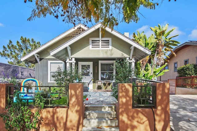 bungalow-style house featuring covered porch