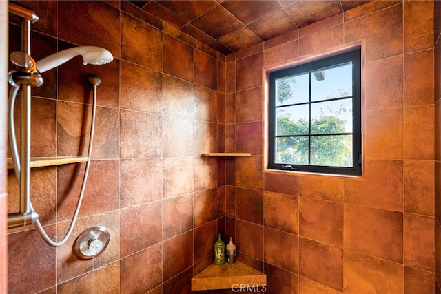 bathroom with tiled shower