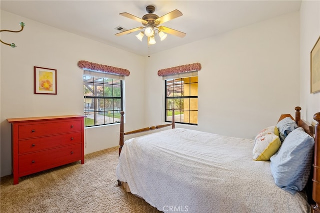 carpeted bedroom with ceiling fan