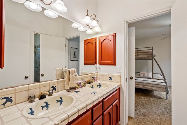 bathroom with vanity with extensive cabinet space and dual sinks