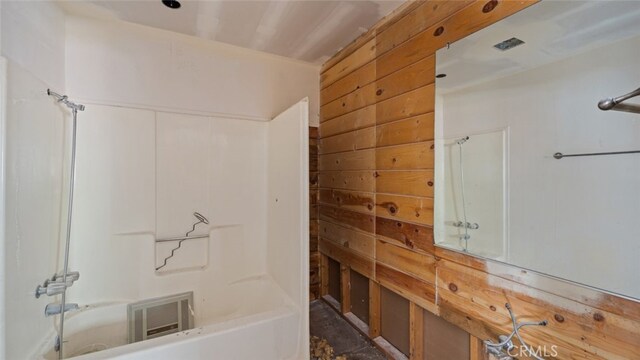 bathroom with wooden walls