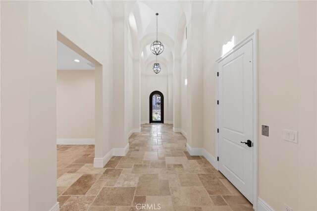 tiled entrance foyer with a high ceiling