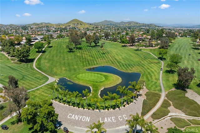 birds eye view of property with a water and mountain view