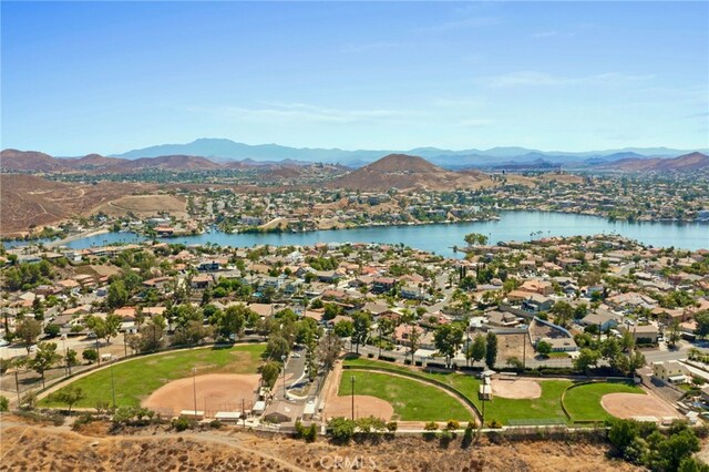 aerial view featuring a water and mountain view