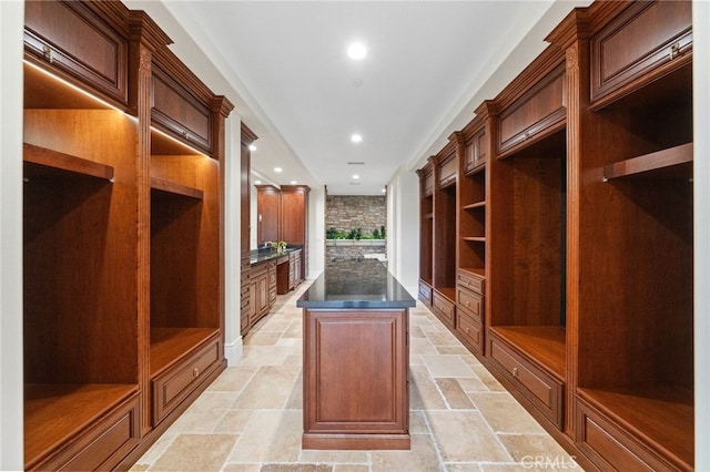 mudroom featuring light tile floors