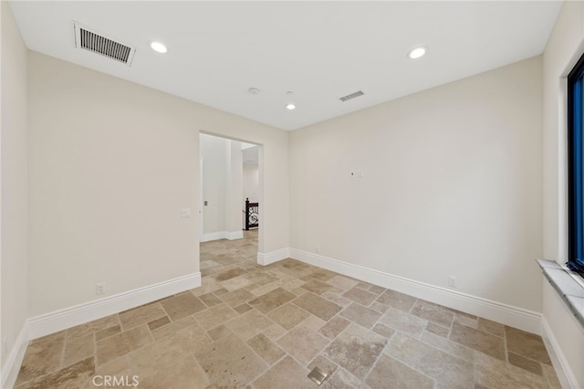 spare room featuring light tile floors