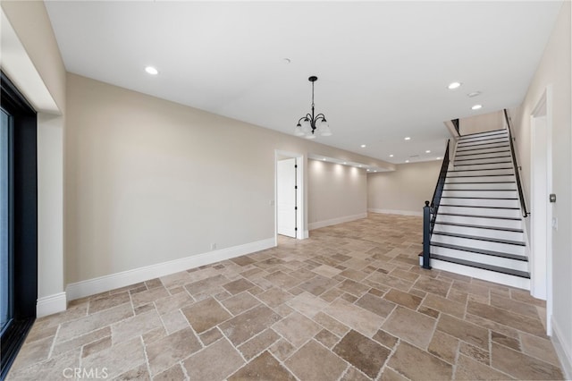 unfurnished living room featuring tile flooring and a notable chandelier