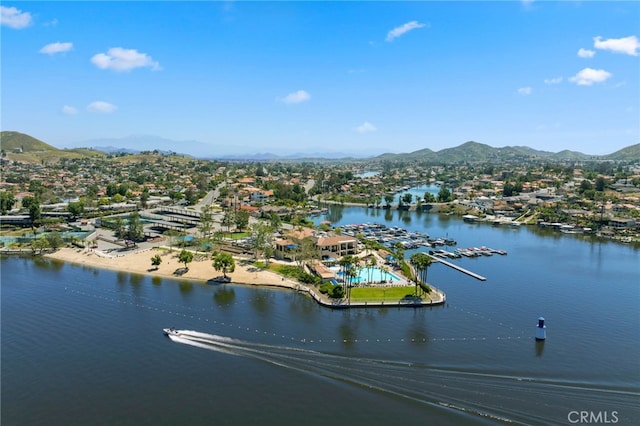 birds eye view of property with a water and mountain view