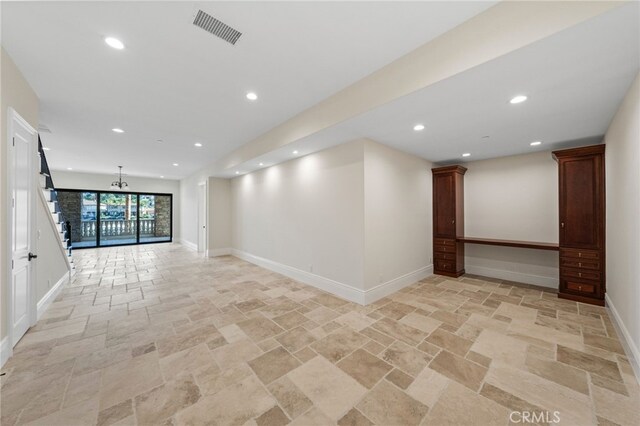 spare room featuring light tile flooring