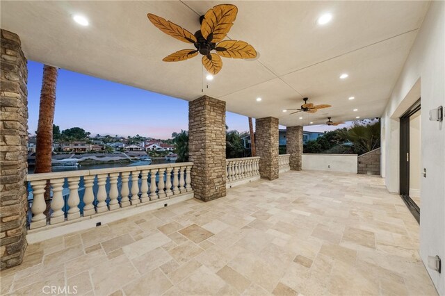 patio terrace at dusk with ceiling fan