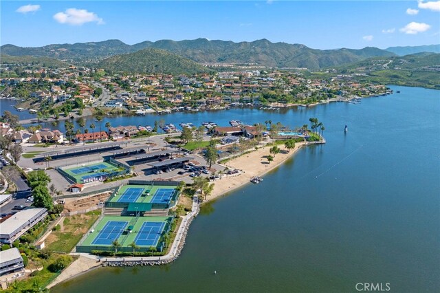 drone / aerial view with a water and mountain view