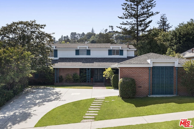 view of front property with a front lawn