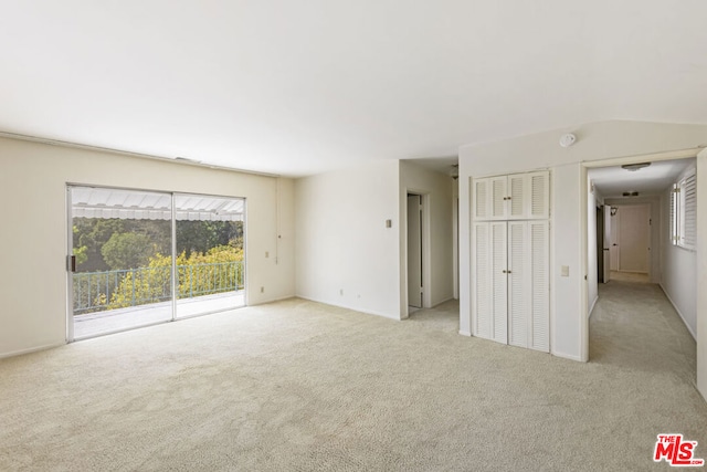 empty room featuring light carpet