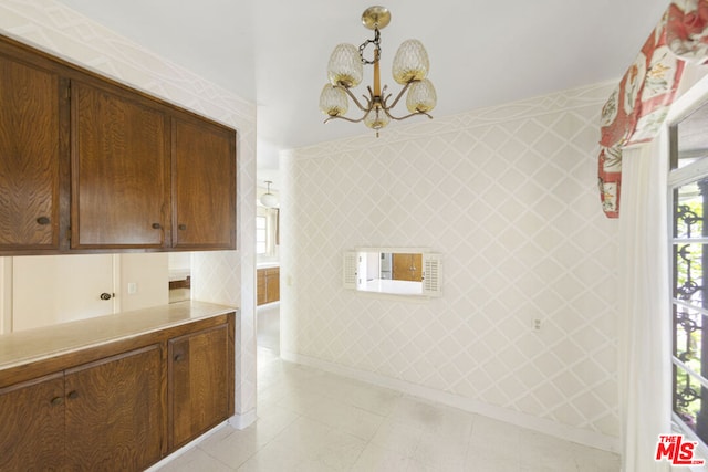 kitchen with a chandelier and hanging light fixtures