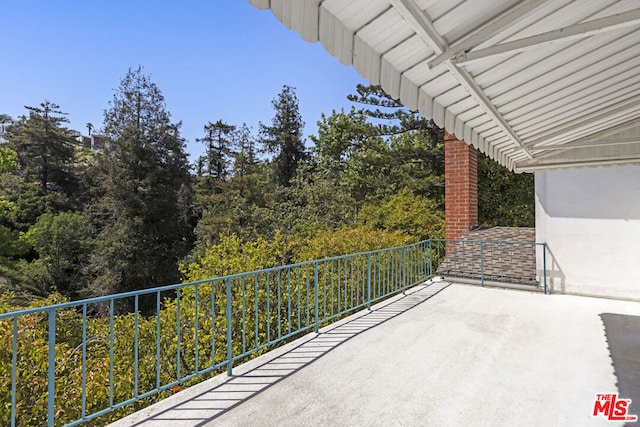 view of patio featuring a balcony