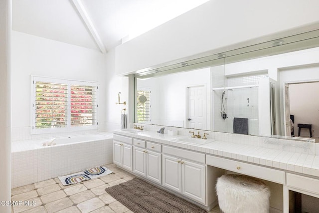 bathroom with separate shower and tub, vanity, and lofted ceiling