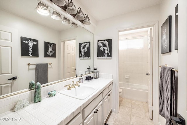 full bathroom with tile patterned flooring, vanity, toilet, and shower / bath combination