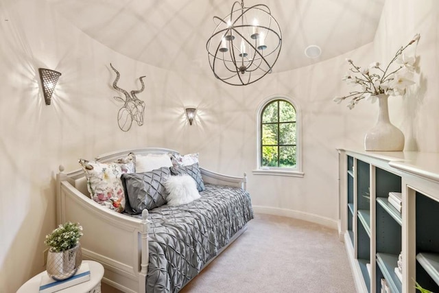 bedroom featuring light colored carpet and an inviting chandelier