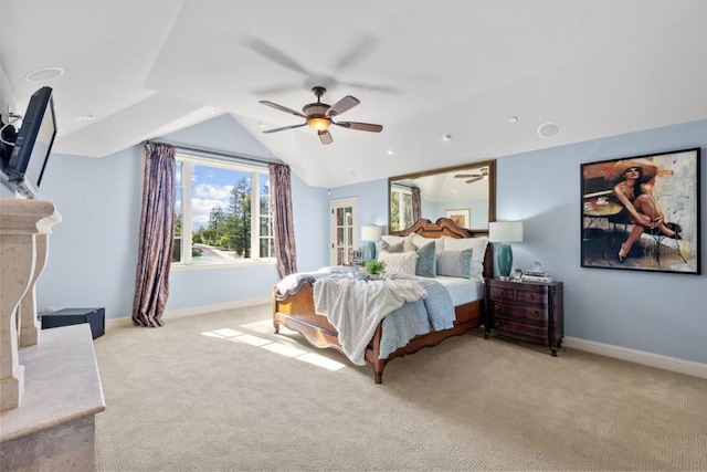 bedroom with ceiling fan, lofted ceiling, and light carpet