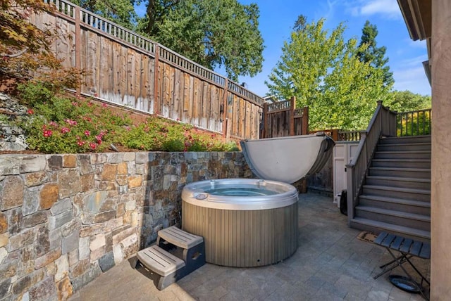 view of patio featuring a hot tub