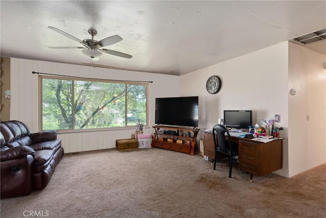 living room with carpet and ceiling fan