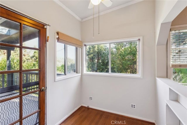 unfurnished sunroom featuring ceiling fan