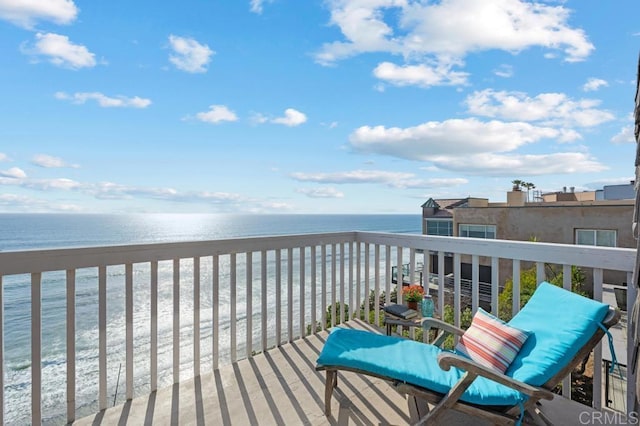 balcony featuring a water view