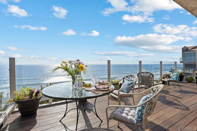 wooden deck featuring a water view