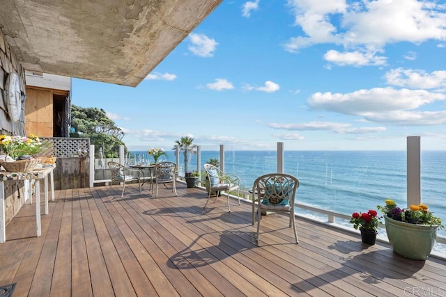 wooden terrace with a water view