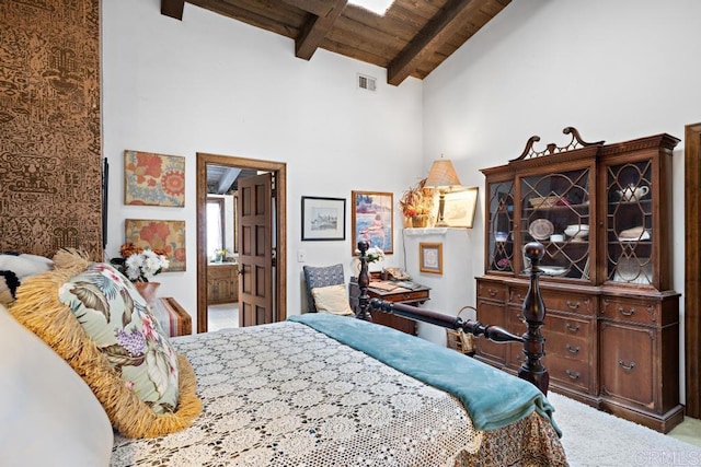 bedroom with carpet flooring, beam ceiling, visible vents, wooden ceiling, and high vaulted ceiling