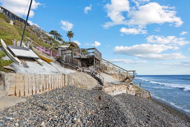 property view of water featuring a beach view