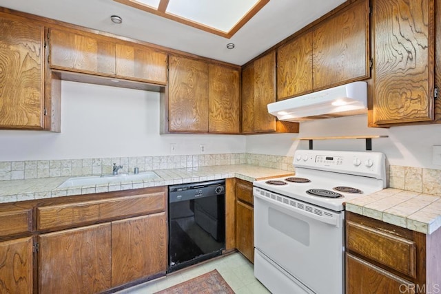 kitchen with a sink, brown cabinetry, white electric stove, under cabinet range hood, and black dishwasher