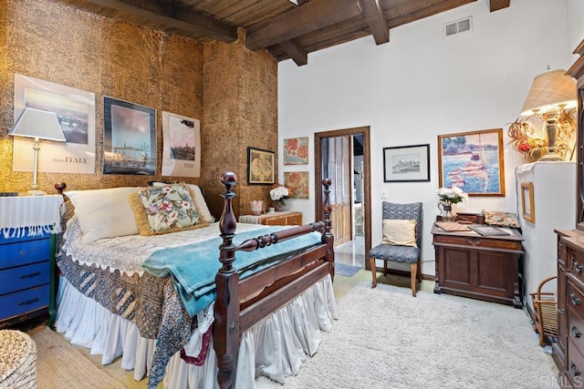 carpeted bedroom with wood ceiling, a towering ceiling, visible vents, and beam ceiling
