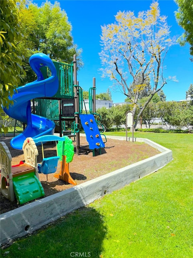 view of jungle gym with a lawn