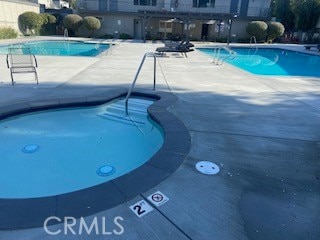 view of swimming pool with a patio area