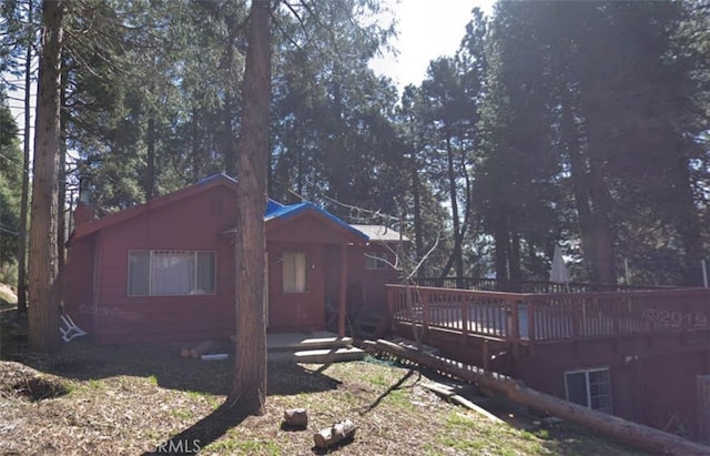 rear view of property with a deck