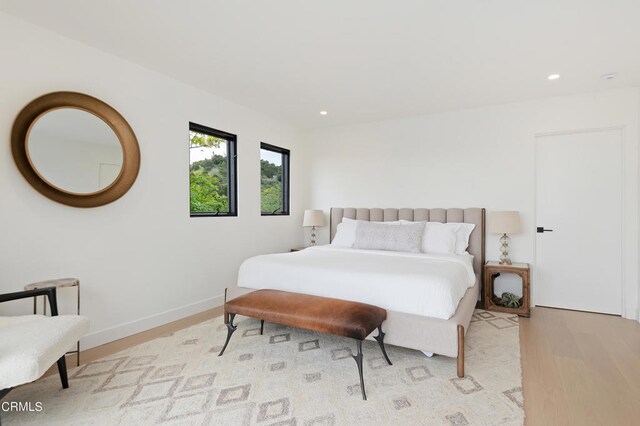 bedroom with hardwood / wood-style flooring