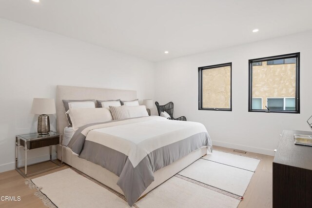 bedroom with wood-type flooring