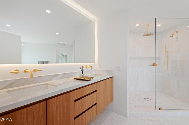 bathroom featuring walk in shower, dual vanity, and tile flooring