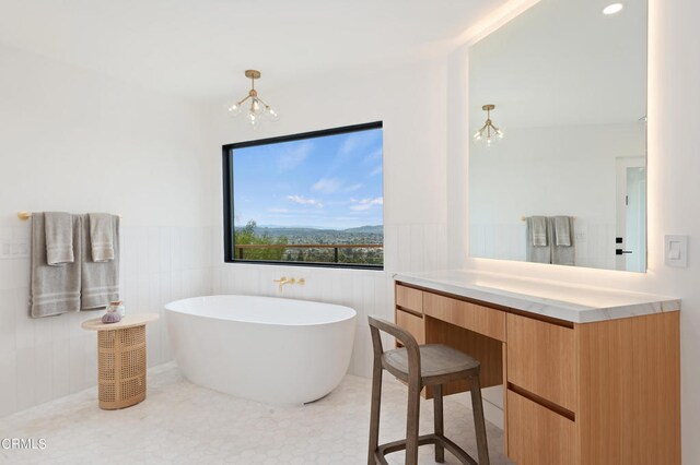 bathroom with vanity and a notable chandelier