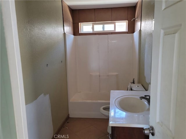 full bathroom featuring tile patterned floors, vanity, tub / shower combination, and toilet