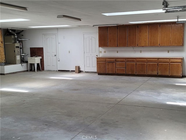 garage with heating unit and sink