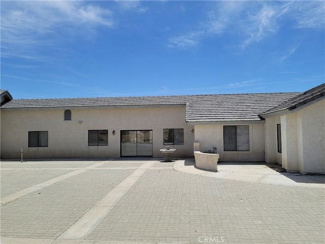 31801 Soapmine Rd, Barstow, CA 92311 - rear view of property featuring stucco siding and a patio