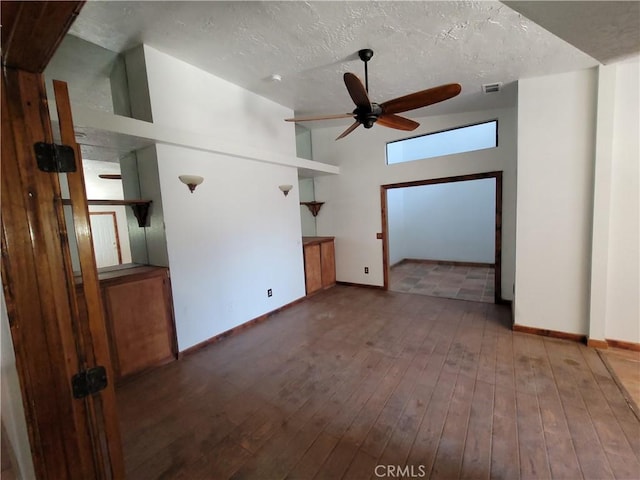 31801 Soapmine Rd, Barstow, CA 92311 - unfurnished living room with ceiling fan, hardwood / wood-style floors, and a textured ceiling