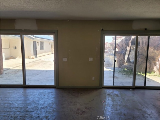 entryway with a textured ceiling