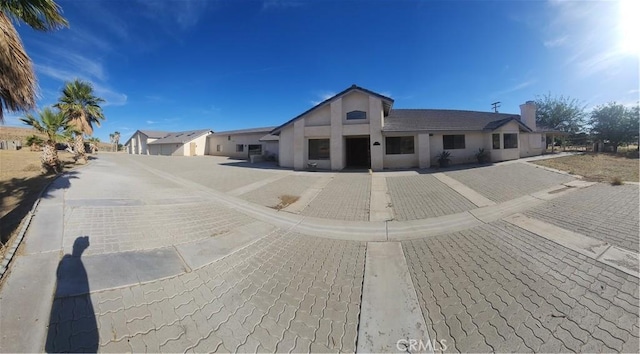 31801 Soapmine Rd, Barstow, CA 92311 - view of front facade featuring stucco siding and a chimney