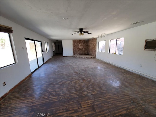 31801 Soapmine Rd, Barstow, CA 92311 - unfurnished living room featuring a ceiling fan and baseboards