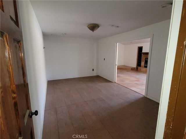 spare room with hardwood / wood-style floors