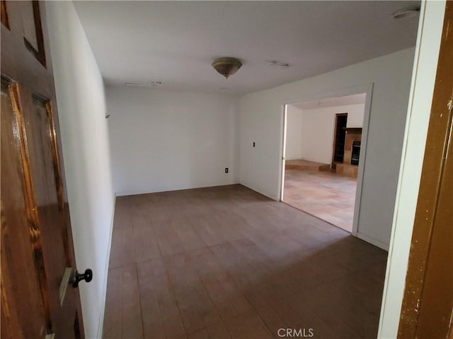 31801 Soapmine Rd, Barstow, CA 92311 - unfurnished room with a fireplace and wood finished floors