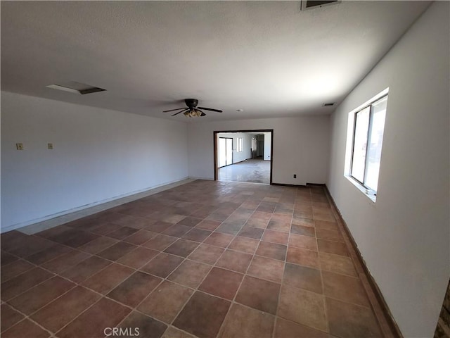 spare room with ceiling fan